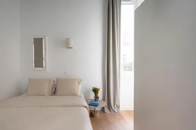 Un ou plusieurs lits dans un hébergement de l'établissement Noble Suites