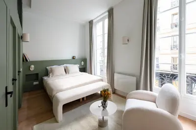 Un ou plusieurs lits dans un hébergement de l'établissement Noble Suites