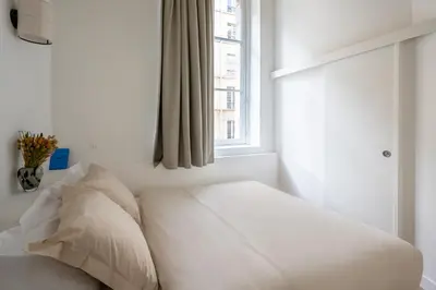 Un ou plusieurs lits dans un hébergement de l'établissement Noble Suites