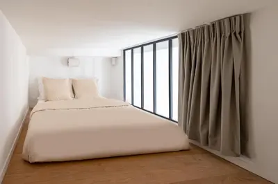 Un ou plusieurs lits dans un hébergement de l'établissement Noble Suites