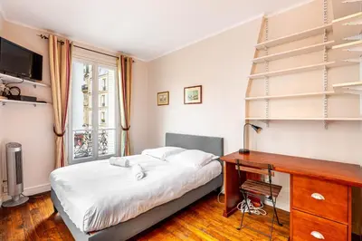 Un ou plusieurs lits dans un hébergement de l'établissement GuestReady - Charmant Appartement Lumineux
