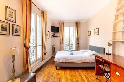 Un ou plusieurs lits dans un hébergement de l'établissement GuestReady - Charmant Appartement Lumineux