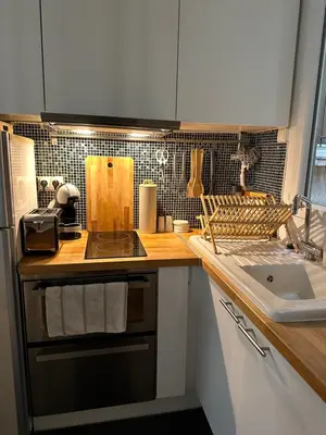 Cuisine ou kitchenette dans l'établissement Appartement proche Montmartre