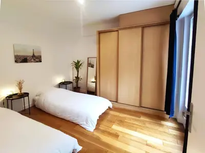 Un ou plusieurs lits dans un hébergement de l'établissement Great apartment with private garden