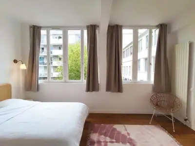 Un ou plusieurs lits dans un hébergement de l'établissement Great apartment with private garden