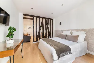 Un ou plusieurs lits dans un hébergement de l'établissement Imhost 7 -Cosy apart Batignolles/Galerie Lafayette