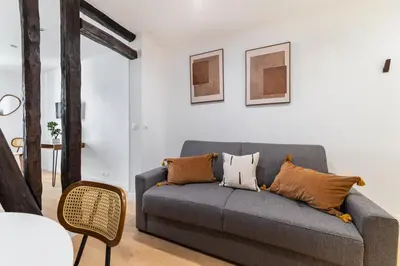 Coin salon dans l'établissement Imhost 7 -Cosy apart Batignolles/Galerie Lafayette