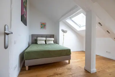 Un ou plusieurs lits dans un hébergement de l'établissement L'appartement du Cirque