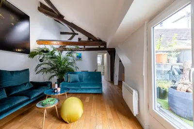 Coin salon dans l'établissement L'appartement du Cirque