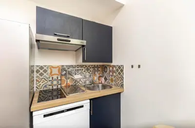 Cuisine ou kitchenette dans l'établissement L'Escapade Paris