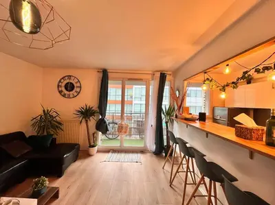 Coin salon dans l'établissement Spacieux, moderne et familiale - Paris à porte - Au pied du métro 14
