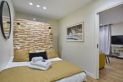 Un ou plusieurs lits dans un hébergement de l'établissement Apartment Sacré coeur by Studio prestige