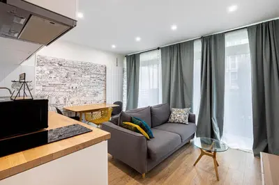 Télévision ou salle de divertissement dans l'établissement GuestReady - 2BR Apt Paris Expo Porte Versailles