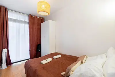 Un ou plusieurs lits dans un hébergement de l'établissement GuestReady - 2BR Apt Paris Expo Porte Versailles