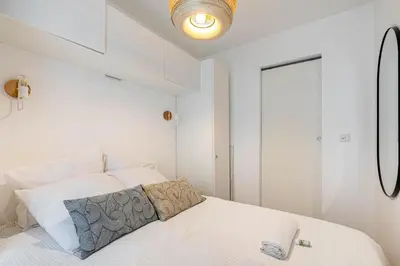 Un ou plusieurs lits dans un hébergement de l'établissement GuestReady - 2BR Apt Paris Expo Porte Versailles
