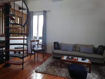 Coin salon dans l'établissement Appartement Paris