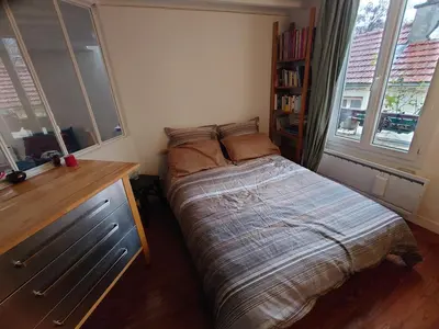 Un ou plusieurs lits dans un hébergement de l'établissement Appartement Paris