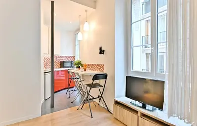 Télévision ou salle de divertissement dans l'établissement Appartement au cœur du Marais - IV
