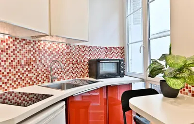 Cuisine ou kitchenette dans l'établissement Appartement au cœur du Marais - IV