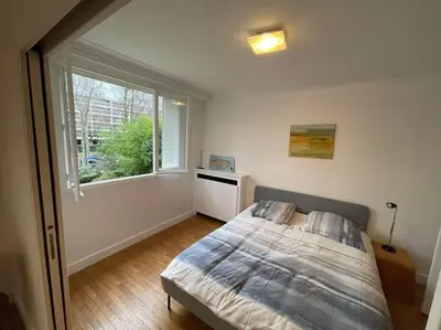 Un ou plusieurs lits dans un hébergement de l'établissement Calme et verdure à 2 pas de Paris