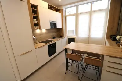 Cuisine ou kitchenette dans l'établissement Cosy 2 chambres Père-Lachaise