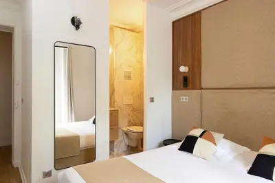 Un ou plusieurs lits dans un hébergement de l'établissement Amazing apartment - 2BR-6P - Nation