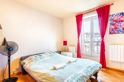 Un ou plusieurs lits dans un hébergement de l'établissement GuestReady - Cosy Haven near Montmartre