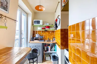 Cuisine ou kitchenette dans l'établissement GuestReady - Cosy Haven near Montmartre