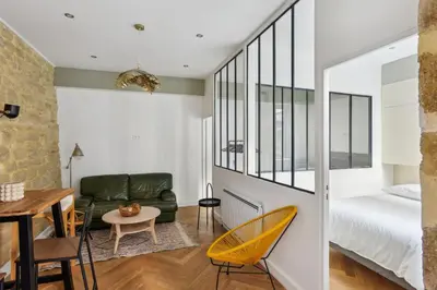 Un ou plusieurs lits dans un hébergement de l'établissement Beau 3 pièces rue Poissonnière