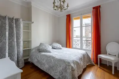 Un ou plusieurs lits dans un hébergement de l'établissement SACRE COEUR Grand Duplex 130 m2 - 4 chambres + double living