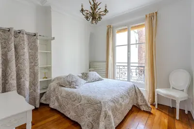 Un ou plusieurs lits dans un hébergement de l'établissement SACRE COEUR Grand Duplex 130 m2 - 4 chambres + double living