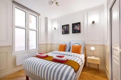 Un ou plusieurs lits dans un hébergement de l'établissement Montmartre 2 Pièces