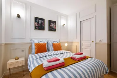 Un ou plusieurs lits dans un hébergement de l'établissement Montmartre 2 Pièces