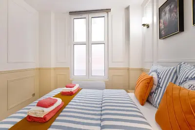 Un ou plusieurs lits dans un hébergement de l'établissement Montmartre 2 Pièces