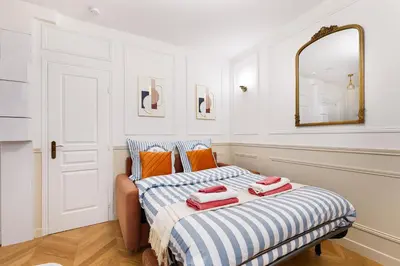 Un ou plusieurs lits dans un hébergement de l'établissement Montmartre 2 Pièces