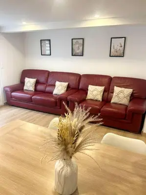 Coin salon dans l'établissement Maison chaleureuse proche Paris