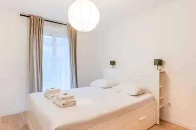 Un ou plusieurs lits dans un hébergement de l'établissement Classy appartement - Flea Market