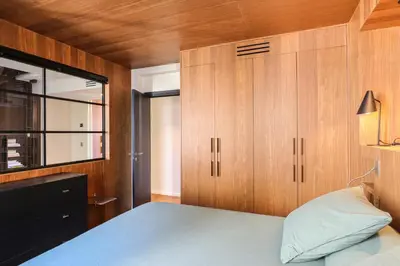 Un ou plusieurs lits dans un hébergement de l'établissement Duplex vue Tour Eiffel