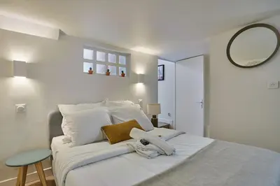 Un ou plusieurs lits dans un hébergement de l'établissement Apartment Saint Germain des prés by Studio prestige