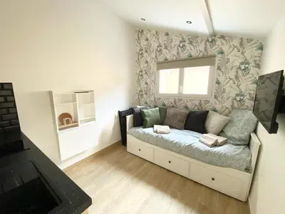 Coin salon dans l'établissement Maisonnette Cosy au calme
