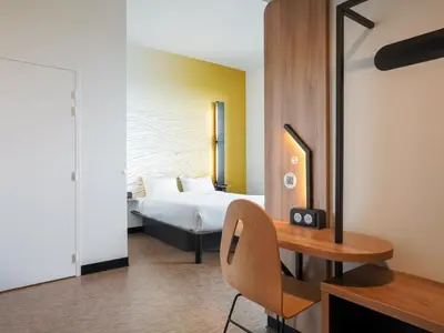 Un ou plusieurs lits dans un hébergement de l'établissement B&B HOTEL Paris Porte d'Orléans