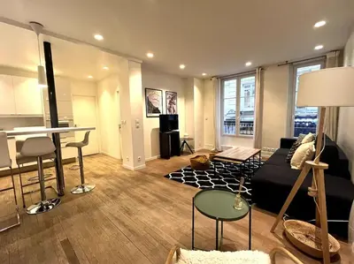 Coin salon dans l'établissement GoodGuest-Cosy Apartment Paris Montorgueil-4 PAX Bail Mobilité