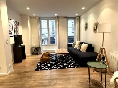 Coin salon dans l'établissement GoodGuest-Cosy Apartment Paris Montorgueil-4 PAX Bail Mobilité