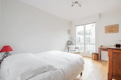 Un ou plusieurs lits dans un hébergement de l'établissement Veeve - Auteuil Adagio