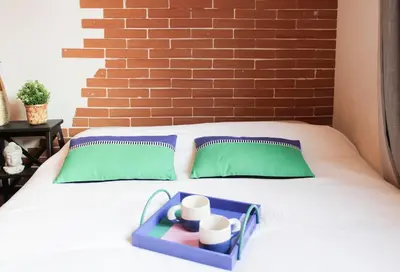 Un ou plusieurs lits dans un hébergement de l'établissement Sunny - Studio confortable près de la Tour Eiffel