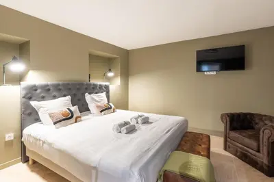 Un ou plusieurs lits dans un hébergement de l'établissement NEW - Appartement Luxeux avec Cinema et Sauna