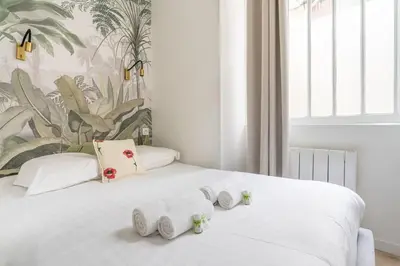 Un ou plusieurs lits dans un hébergement de l'établissement NEW - Appartement Luxeux avec Cinema et Sauna