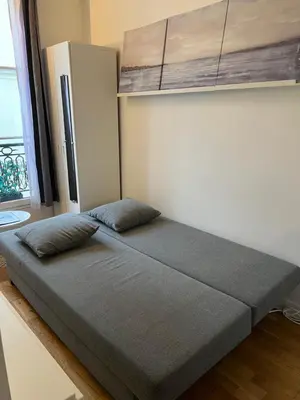 Un ou plusieurs lits dans un hébergement de l'établissement Studio Île Saint-Louis (Cathédrale Notre Dame)