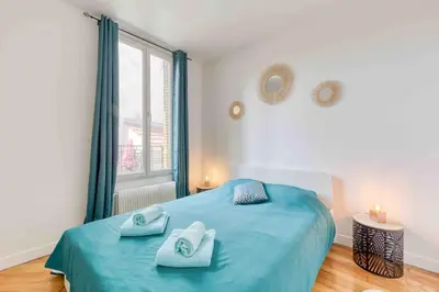 Un ou plusieurs lits dans un hébergement de l'établissement Appartement cosy au calme, proche de Paris et du RER B