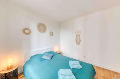 Un ou plusieurs lits dans un hébergement de l'établissement Appartement cosy au calme, proche de Paris et du RER B